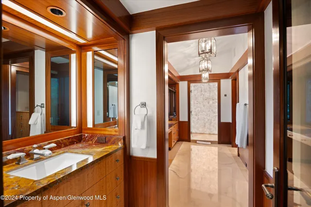 a view of a kitchen with furniture and wooden floor