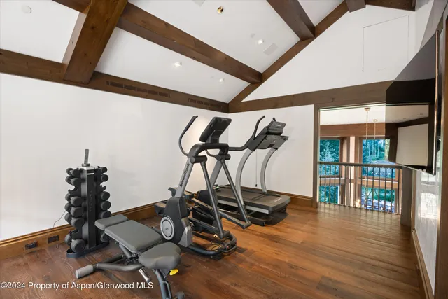 a en suite bathroom with a granite countertop sink and a mirror