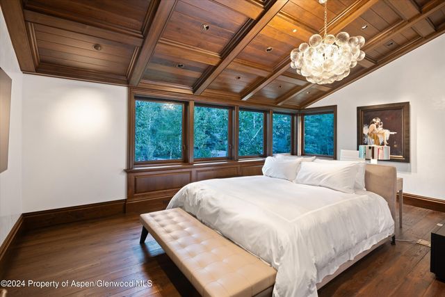 a bathroom with a granite countertop sink mirror and toilet