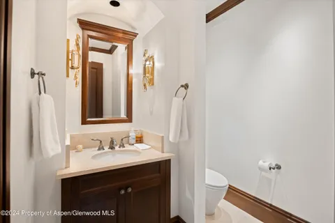 a view of a patio with a table chairs and a backyard