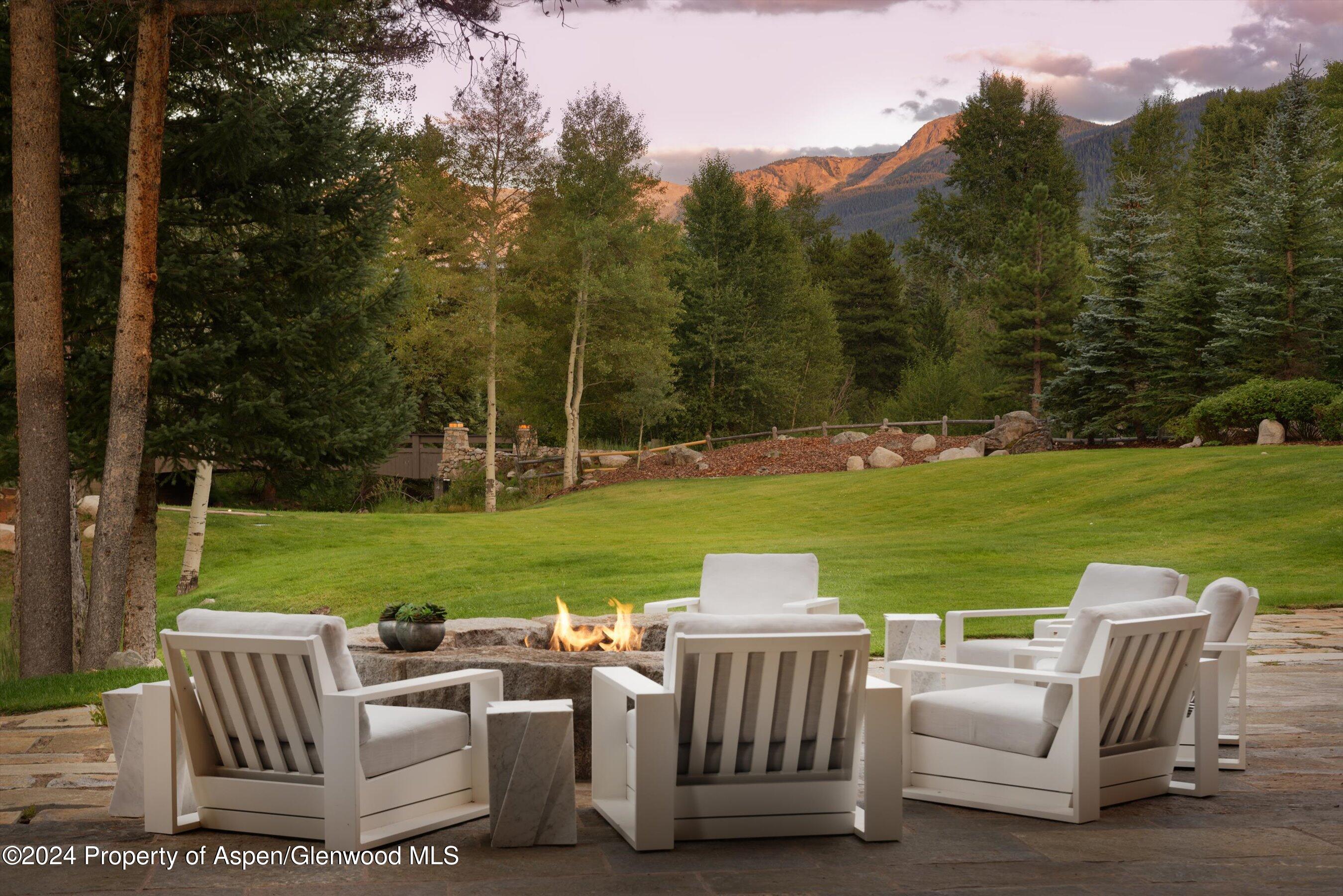 41 Popcorn Lane Aspen, CO 81611 - Photo 43 of 54 a view of a patio with furniture and garden