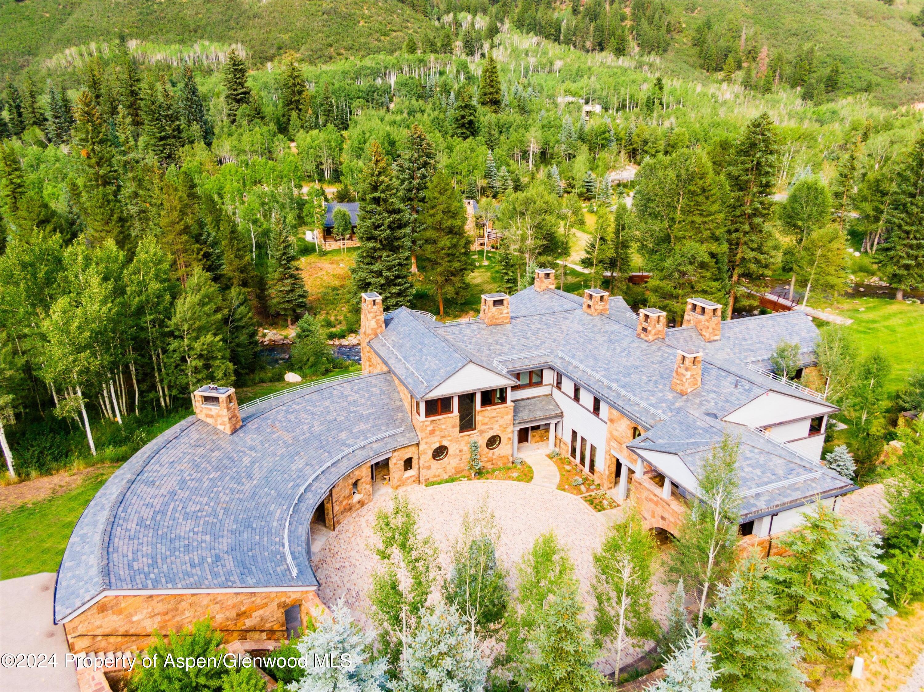 41 Popcorn Lane Aspen, CO 81611 - Photo 44 of 54 an aerial view of a house with a yard and lake view