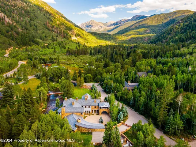 an aerial view of a house with a garden