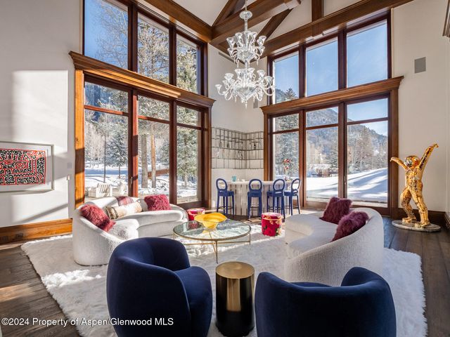 a room with furniture and a large window