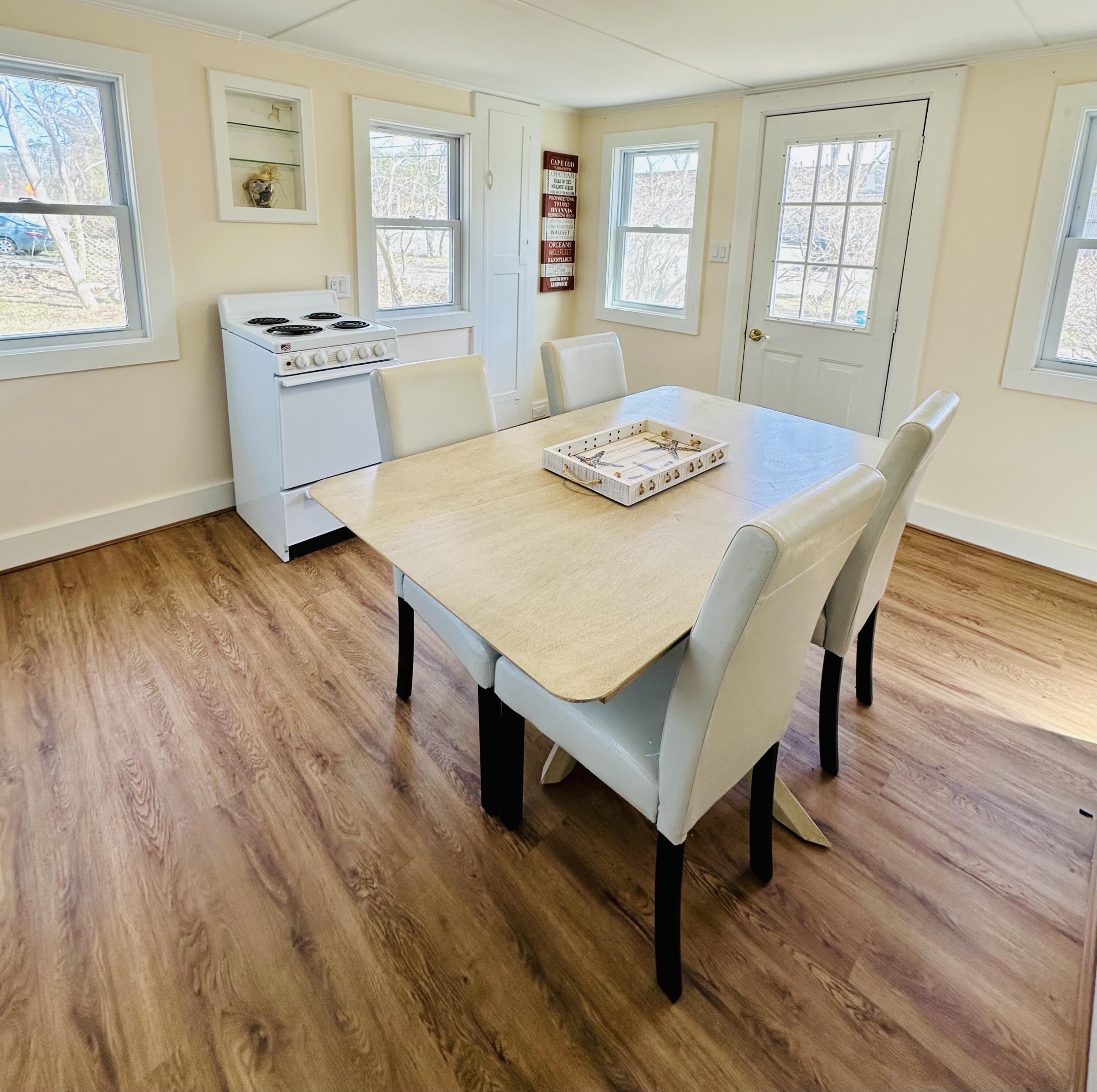36 Cove Road Wellfleet, MA 02667 - Photo 12 of 22 a view of a dining room with furniture and wooden floor