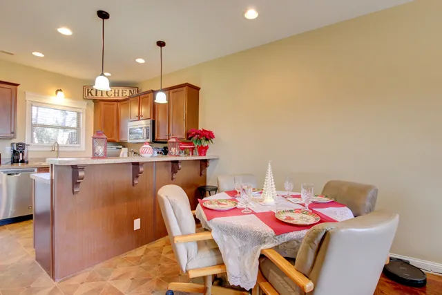 a dining room with furniture and window
