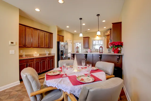 a dining room with furniture and wooden floor