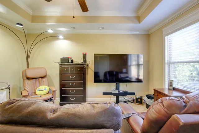 a bedroom with a bed and flat screen tv