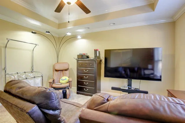 a living room with a couch and a flat screen tv
