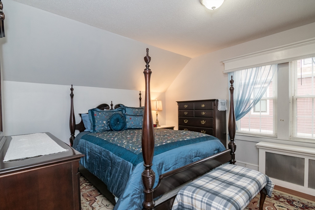 108 Brunswick Street Springfield, MA 01108 - Photo 17 of 42 a bedroom with a bed and a window