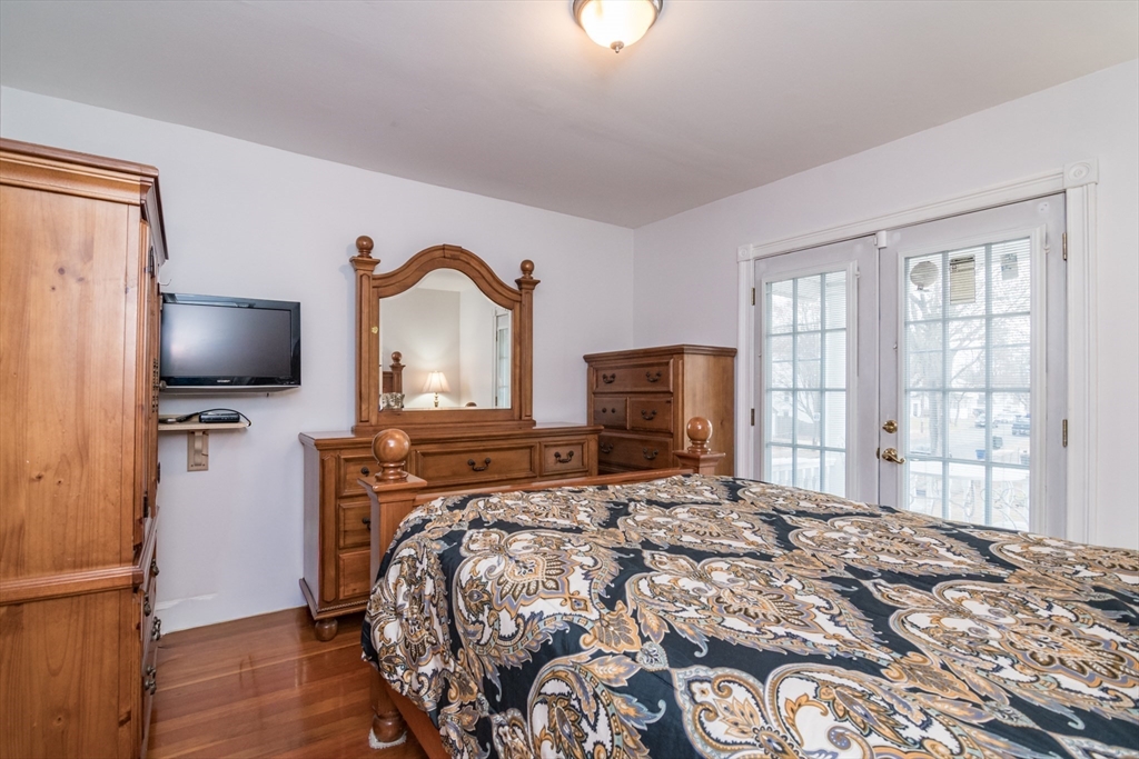 108 Brunswick Street Springfield, MA 01108 - Photo 20 of 42 a bedroom with a bed and a flat screen tv