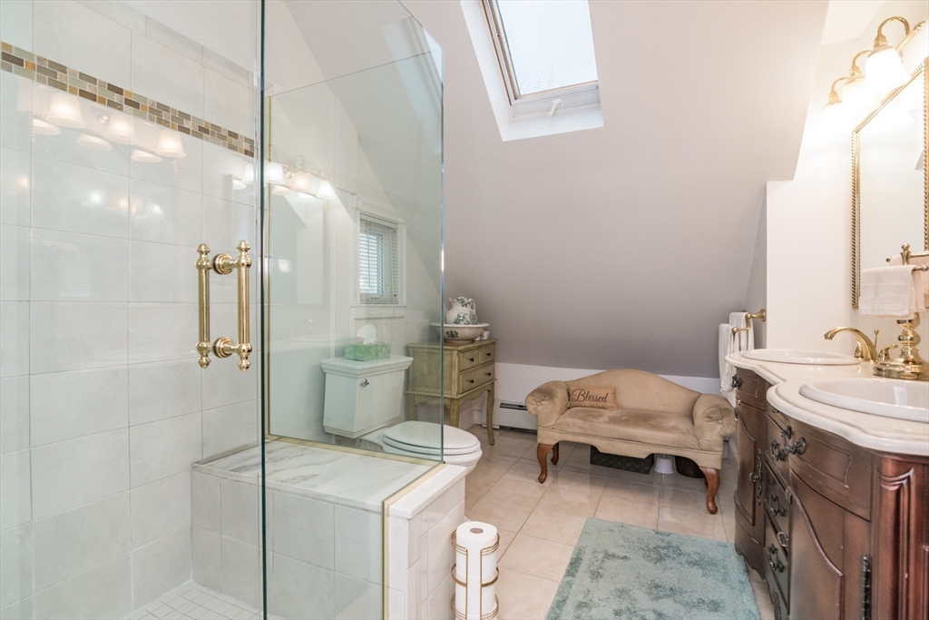 108 Brunswick Street Springfield, MA 01108 - Photo 25 of 42 a bathroom with a sink toilet and shower