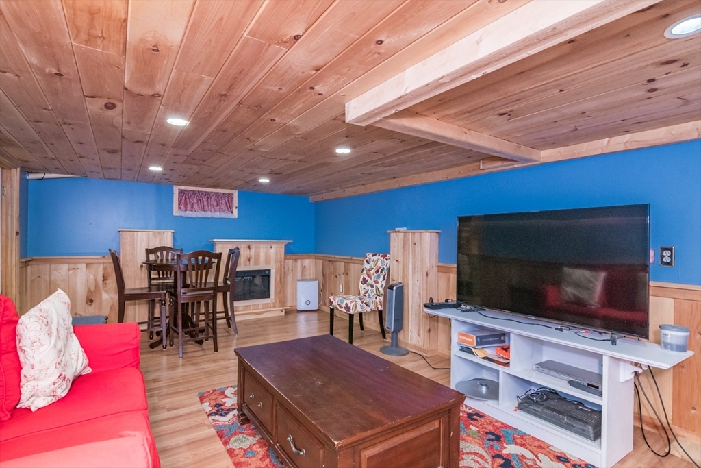 108 Brunswick Street Springfield, MA 01108 - Photo 26 of 42 a living room with furniture and a flat screen tv