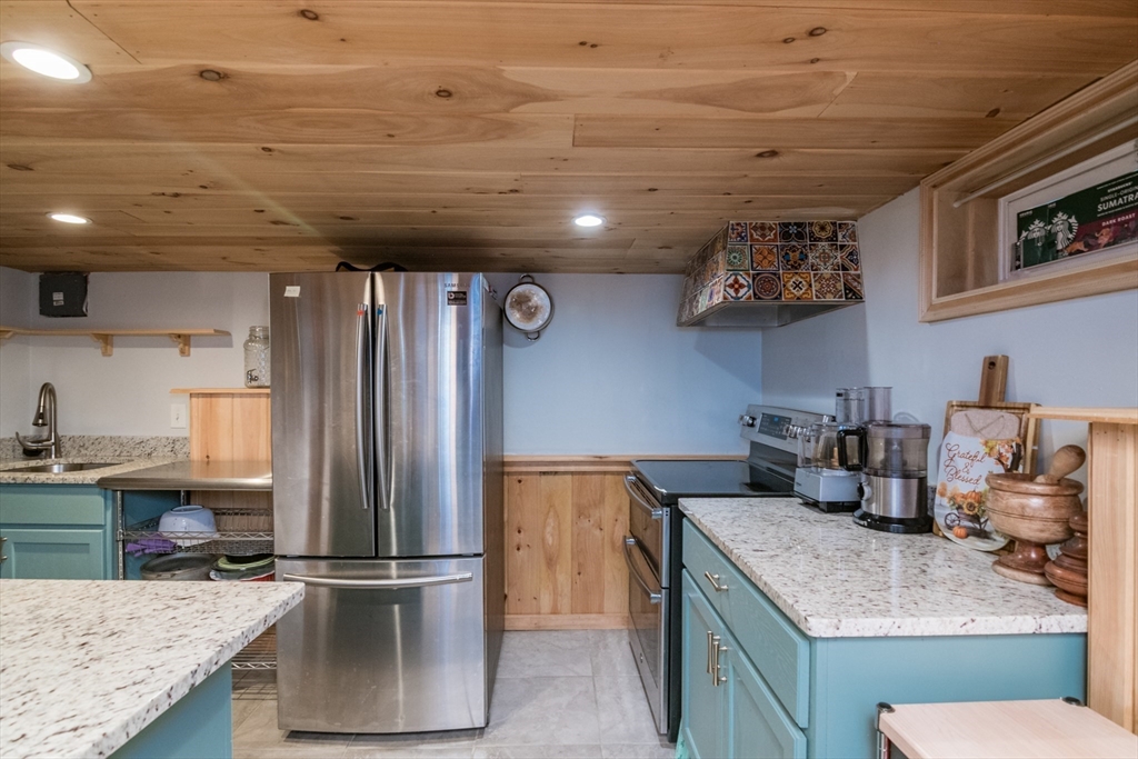 108 Brunswick Street Springfield, MA 01108 - Photo 30 of 42 a kitchen with a refrigerator and a sink