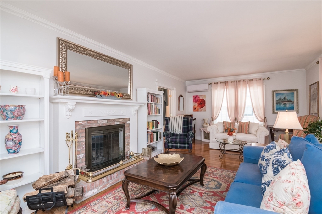 108 Brunswick Street Springfield, MA 01108 - Photo 3 of 42 a living room with furniture window and a fireplace