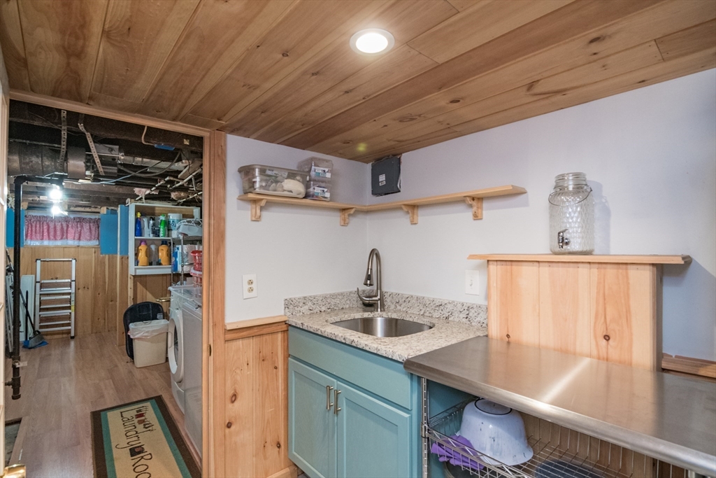 108 Brunswick Street Springfield, MA 01108 - Photo 31 of 42 a kitchen with a sink appliances and cabinets