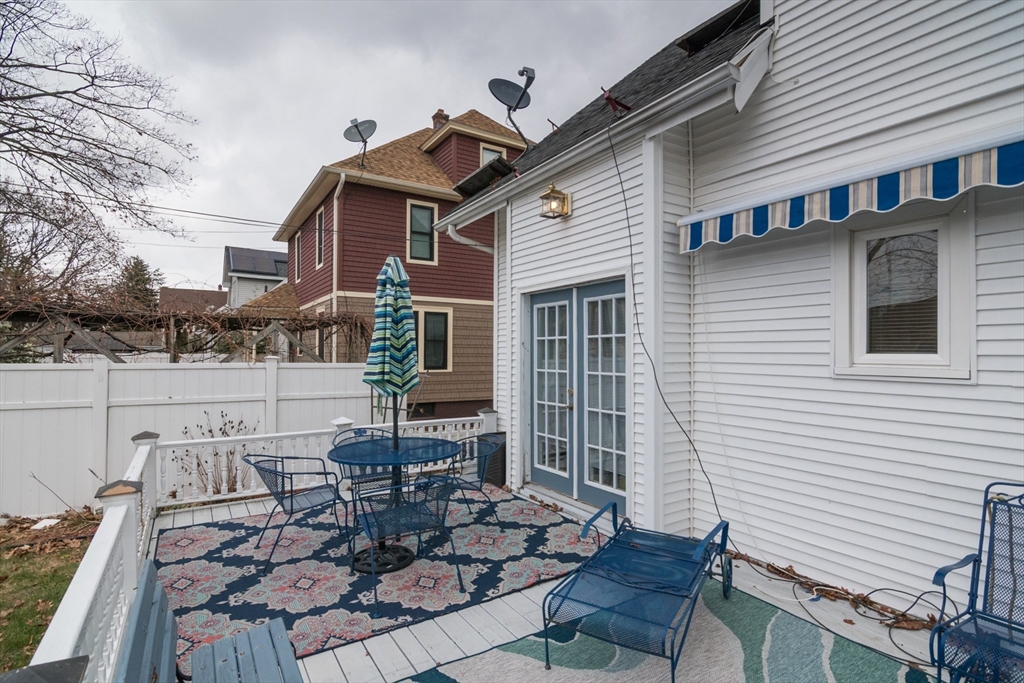 108 Brunswick Street Springfield, MA 01108 - Photo 34 of 42 a view of a patio with table and chairs and potted plants