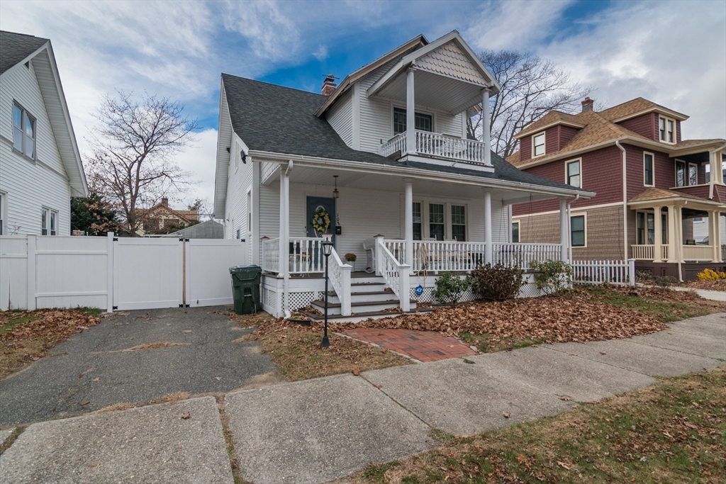 108 Brunswick Street Springfield, MA 01108 - Photo 38 of 42 a view of a white house with large windows next to a road