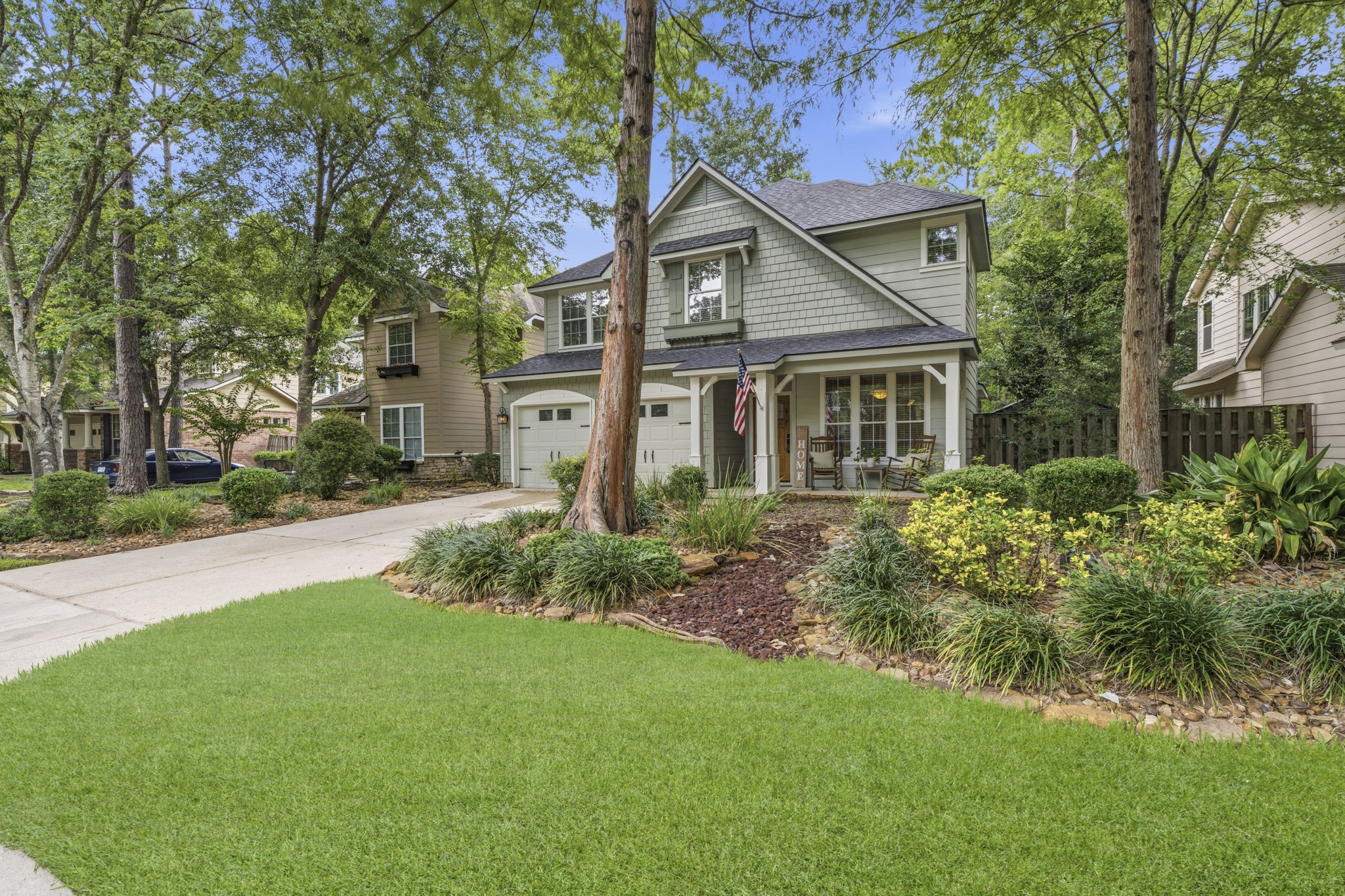 6 North Flickering Sun Circle Spring, TX 77382 - Photo 2 of 33 Mature shade trees perfect for sitting on the front porch.