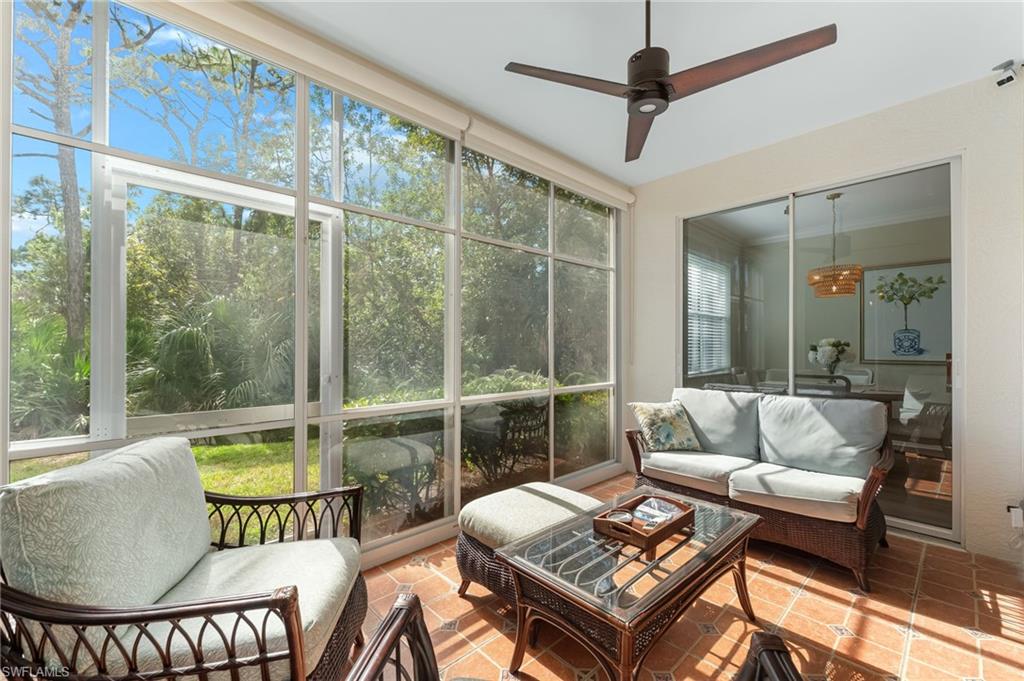 817 Carrick Bend Circle, Unit 102 Naples, FL 34110 - Photo 24 of 36 Sunroom featuring an outdoor hangout area and a ceiling fan