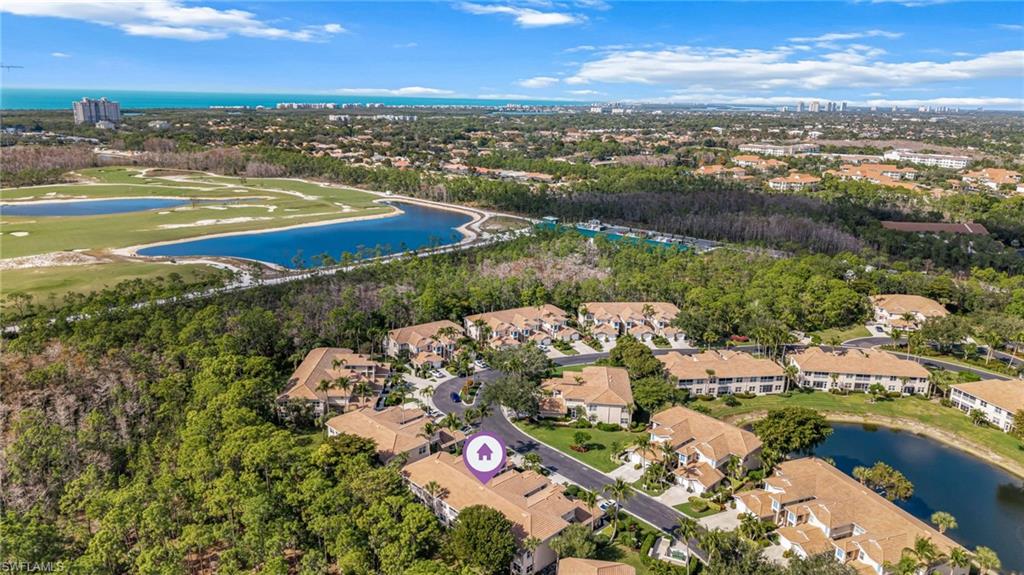 817 Carrick Bend Circle, Unit 102 Naples, FL 34110 - Photo 28 of 36 Aerial view of property's location featuring a nearby body of water and nearby suburban area