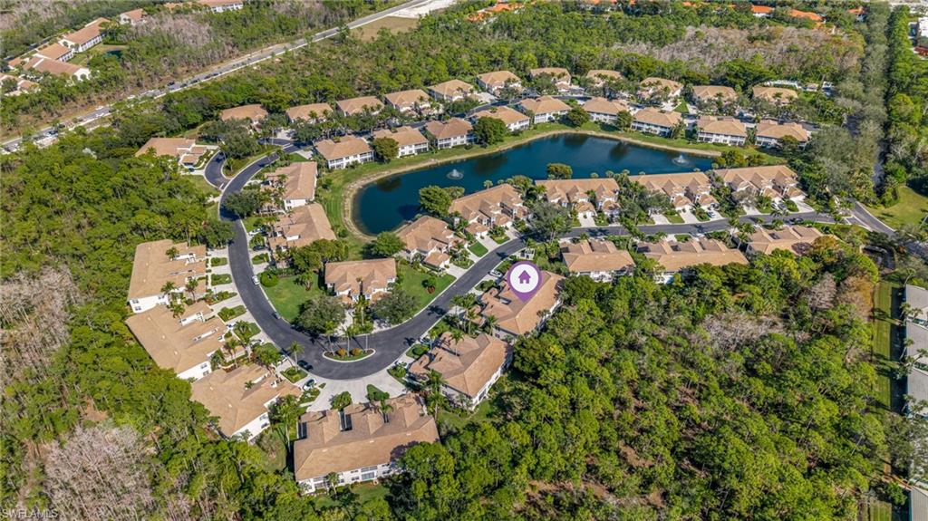 817 Carrick Bend Circle, Unit 102 Naples, FL 34110 - Photo 30 of 36 Aerial overview of property's location with a large body of water and nearby suburban area