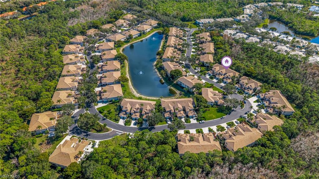 817 Carrick Bend Circle, Unit 102 Naples, FL 34110 - Photo 31 of 36 Aerial view of property's location with a large body of water and nearby suburban area