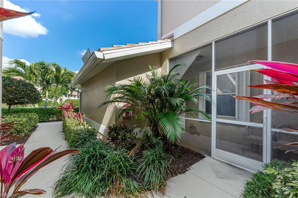 817 Carrick Bend Circle, Unit 102 Naples, FL 34110 - Photo 4 of 36 View of home's exterior with stucco siding