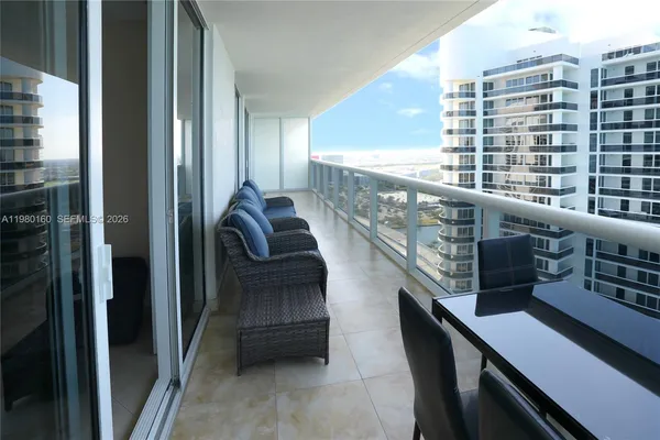 a view of balcony with furniture