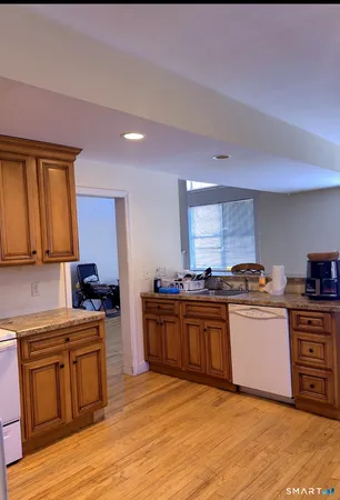 a kitchen with stainless steel appliances granite countertop a stove and a sink