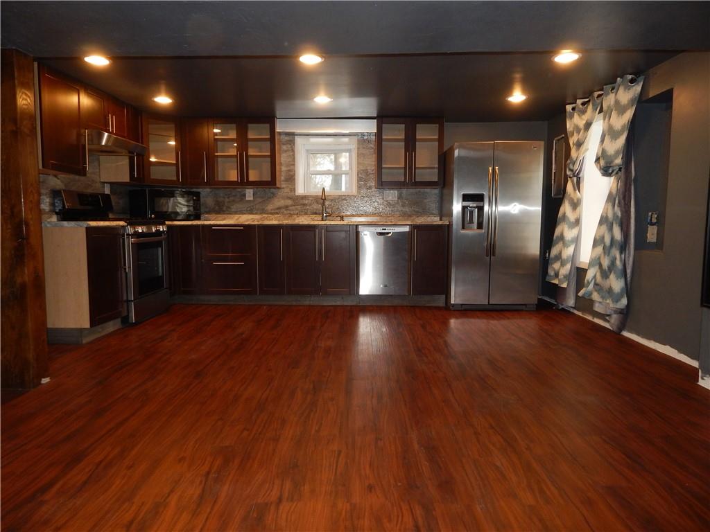 543 Oneida Valley Road Butler, PA 16001 - Photo 14 of 30 a kitchen with stainless steel appliances granite countertop a refrigerator a sink and a stove