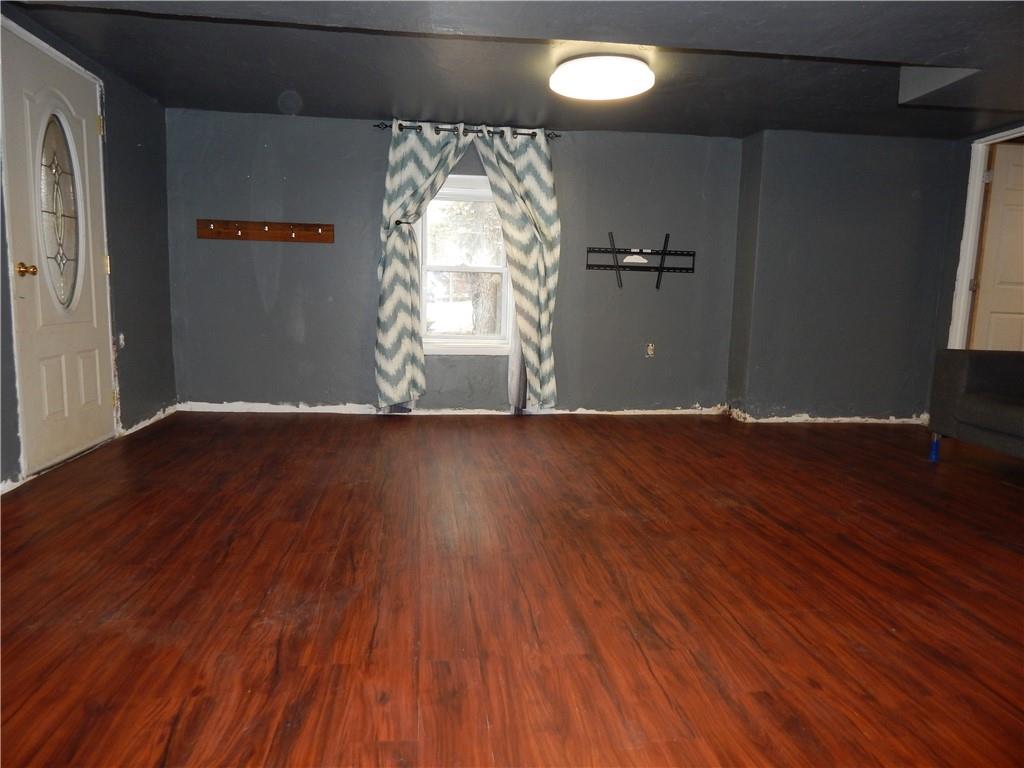 543 Oneida Valley Road Butler, PA 16001 - Photo 17 of 30 an empty room with wooden floor and windows