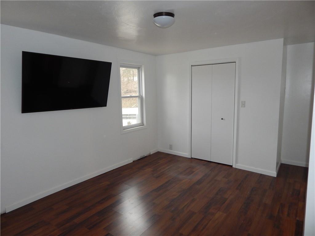 543 Oneida Valley Road Butler, PA 16001 - Photo 23 of 30 a view of an empty room with wooden floor and a window