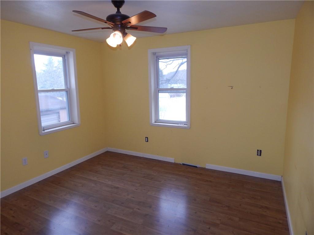 543 Oneida Valley Road Butler, PA 16001 - Photo 24 of 30 a view of an empty room with window and wooden floor