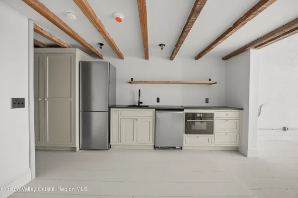 a view of a kitchen with appliances and cabinets