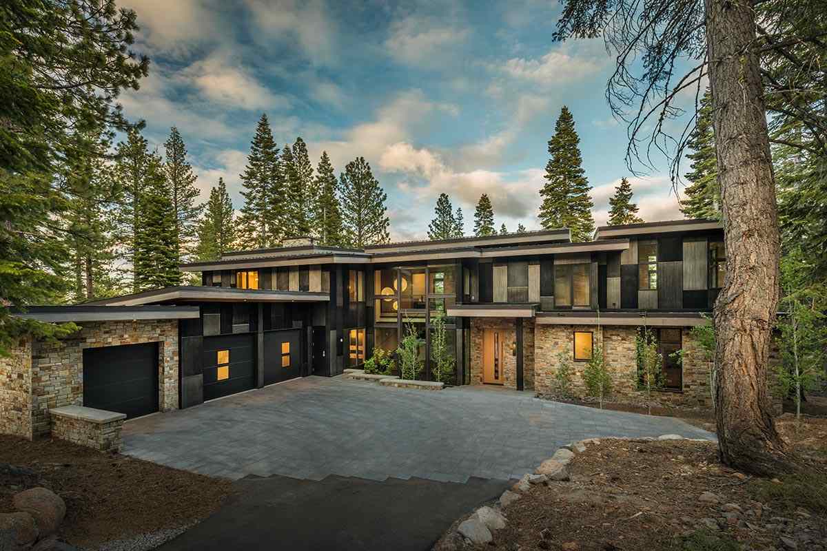 8348 Valhalla Drive Truckee, CA 96161 - Photo 1 of 14 a front view of a house with a yard and garage