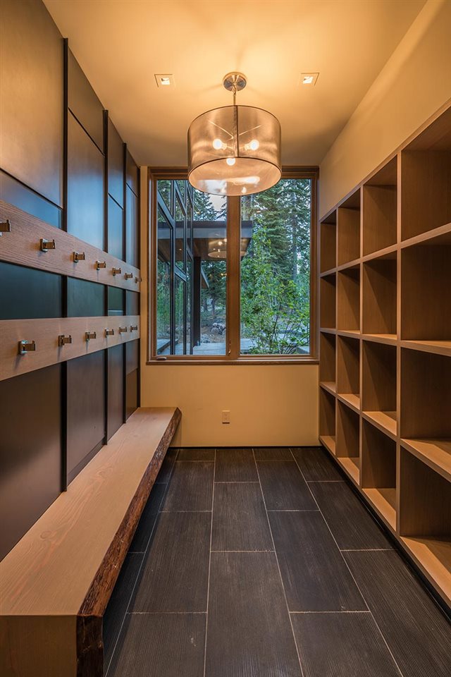 8348 Valhalla Drive Truckee, CA 96161 - Photo 13 of 14 a kitchen with stainless steel appliances a large counter top space cabinets and a chandelier
