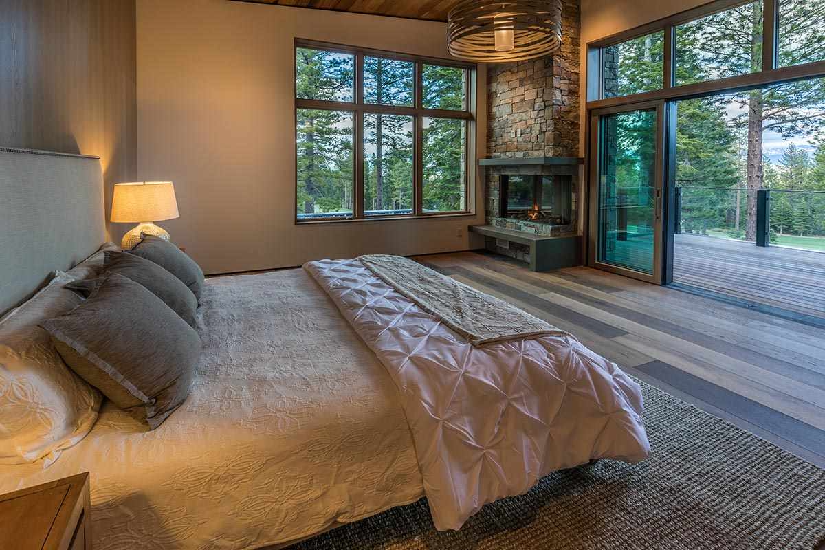 8348 Valhalla Drive Truckee, CA 96161 - Photo 8 of 14 a bed sitting in a bedroom next to a large window