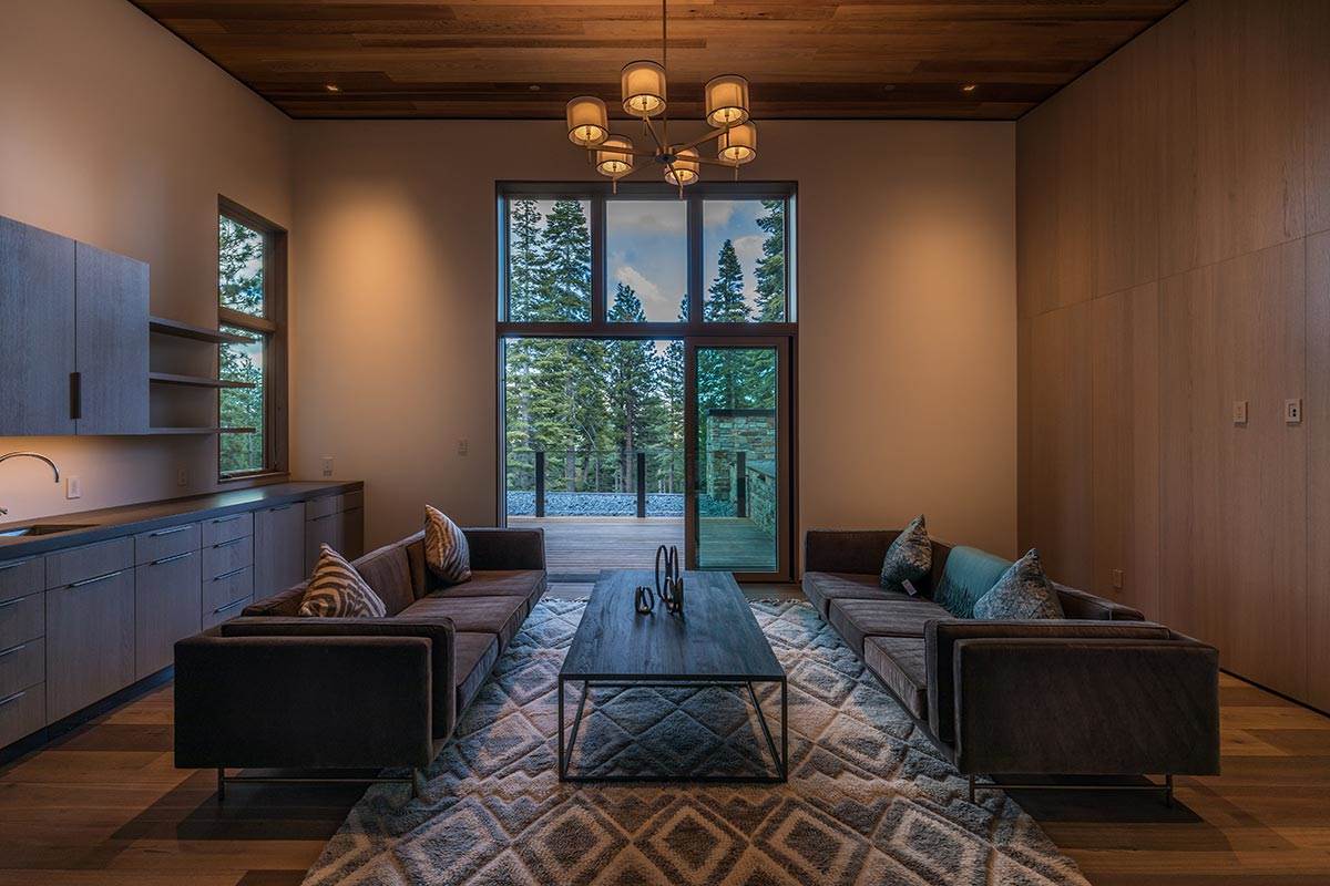 8348 Valhalla Drive Truckee, CA 96161 - Photo 10 of 14 a living room with furniture a chandelier and a window