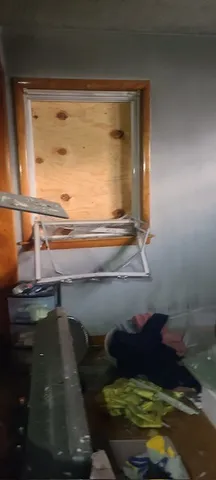 a room with water heater and wooden floor