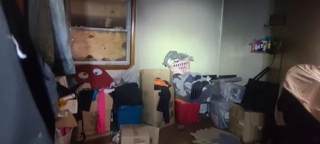 a view of walk in closet with clothes