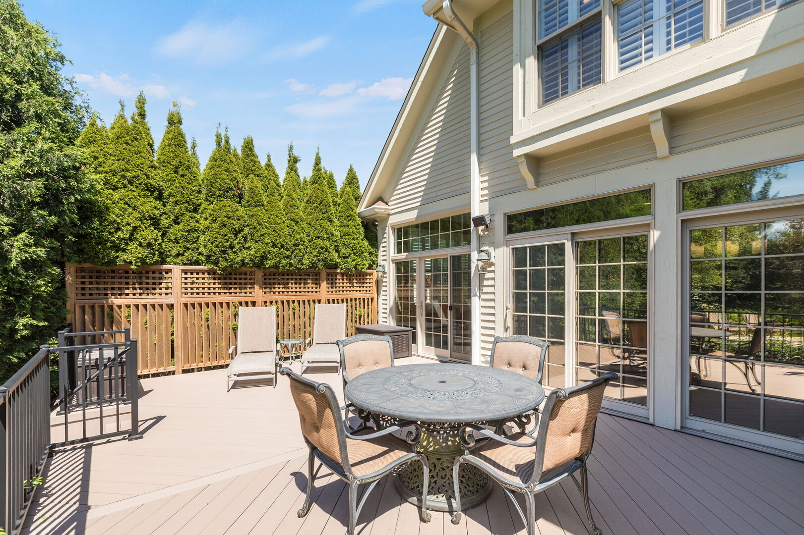 209 Carriage Trail Barrington, IL 60010 - Photo 36 of 42 a view of a patio with table and chairs with wooden floor and fence