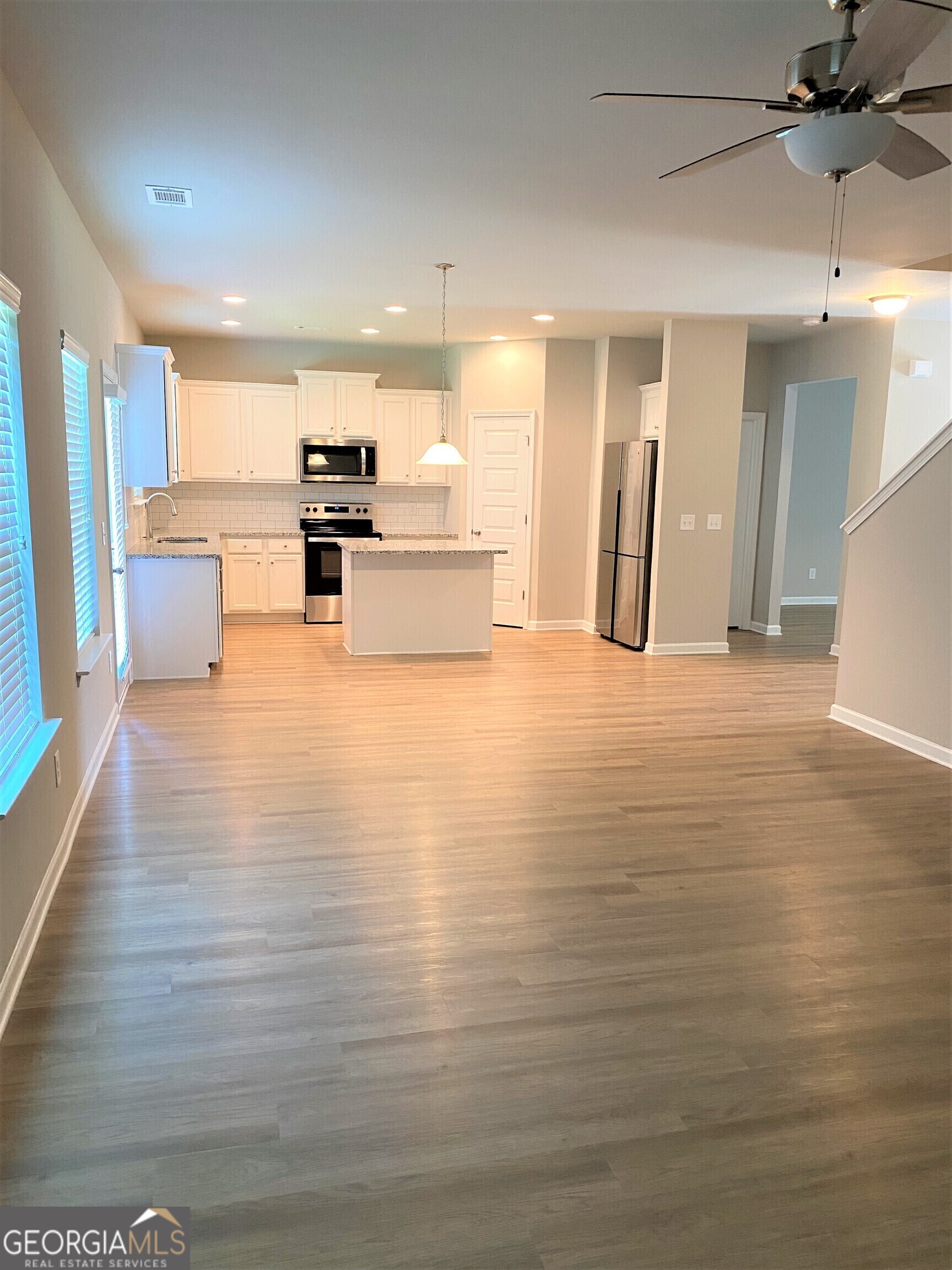 216 Finley Drive Commerce, GA 30529 - Photo 2 of 22 a view of kitchen with stainless steel appliances refrigerator and microwave