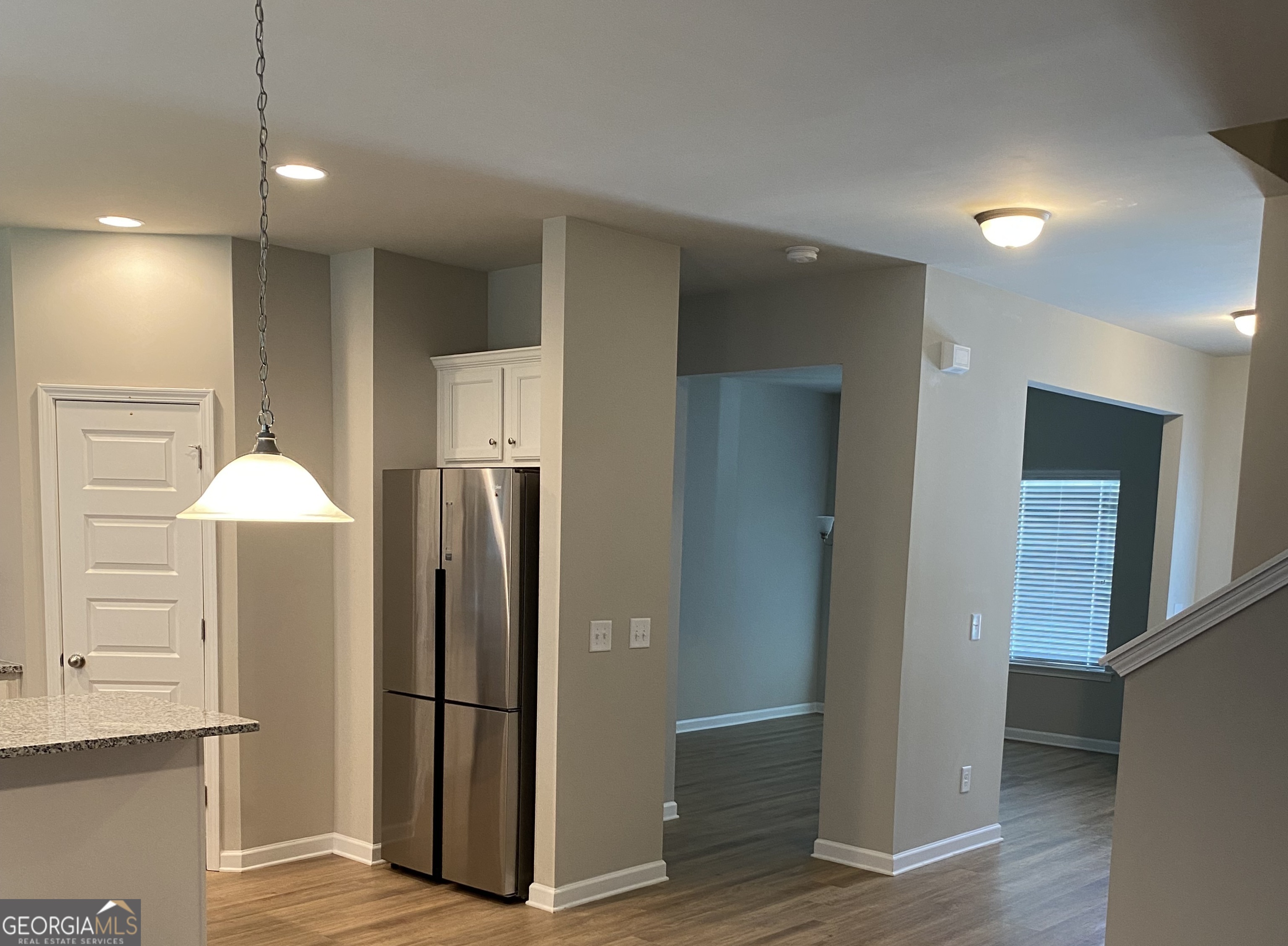 216 Finley Drive Commerce, GA 30529 - Photo 5 of 22 a view of a kitchen with a refrigerator and a sink