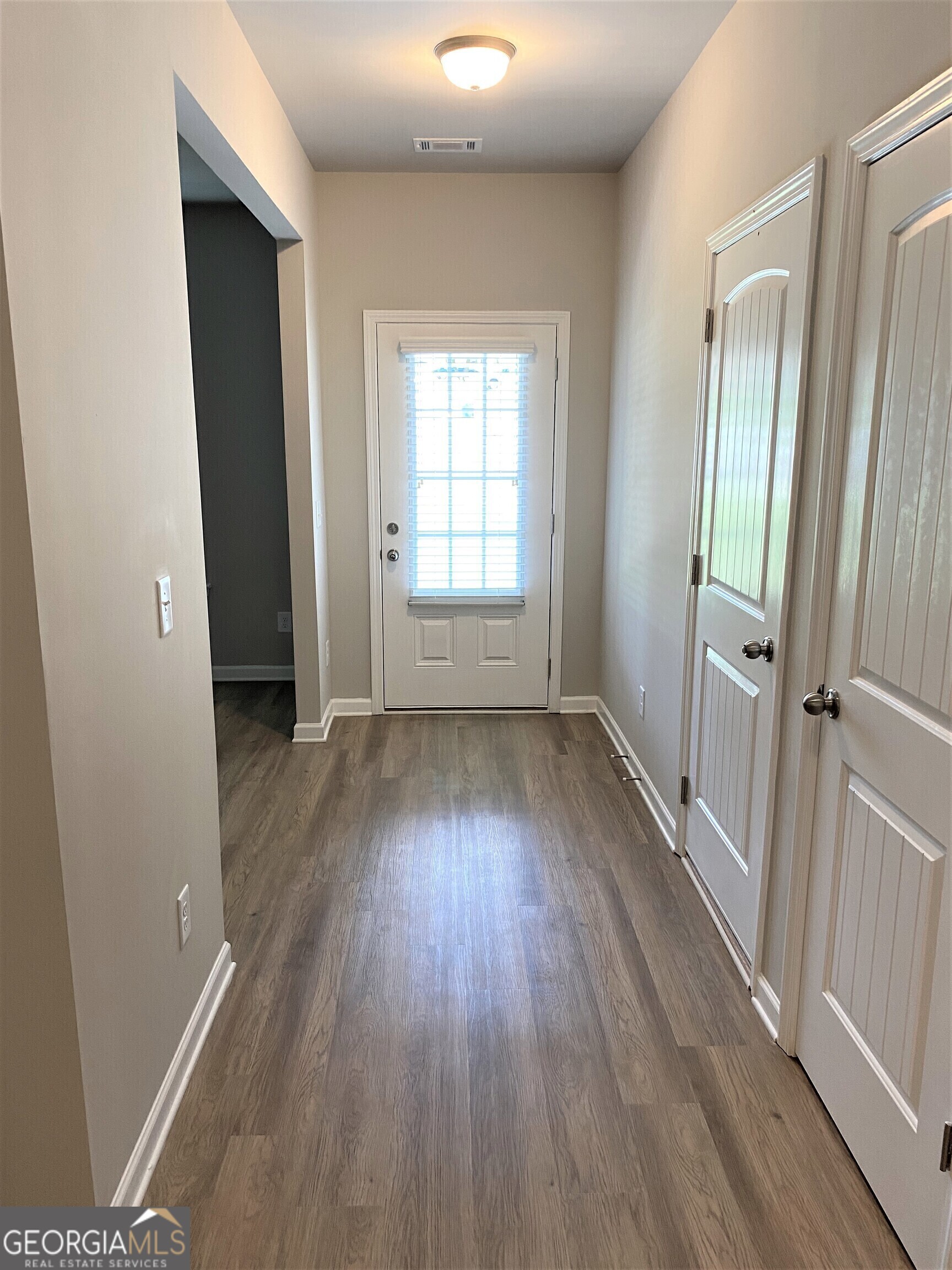 216 Finley Drive Commerce, GA 30529 - Photo 6 of 22 wooden floor in an empty room with a window