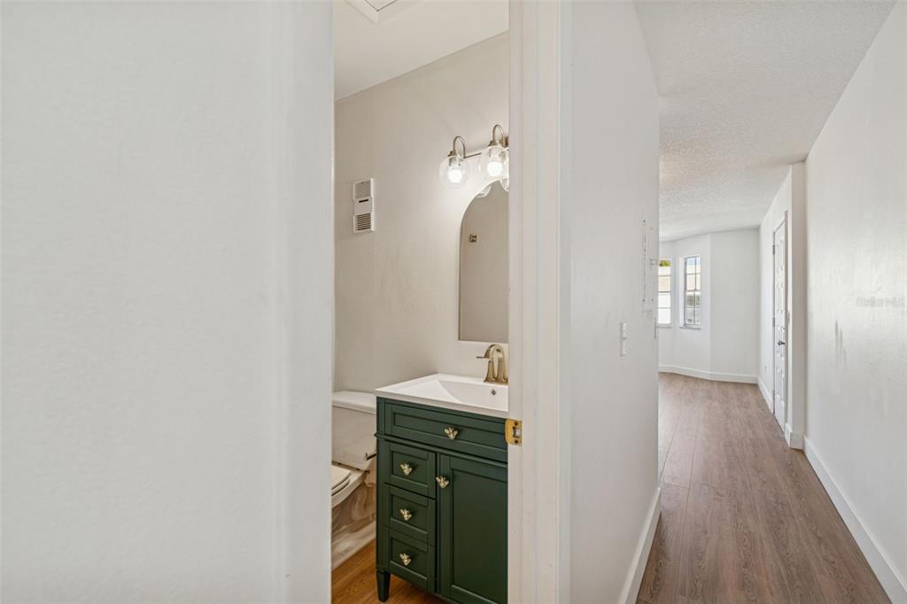 4511 South Oak Drive, Unit R32A Tampa, FL 33611 - Photo 15 of 27 a bathroom with a sink and a mirror