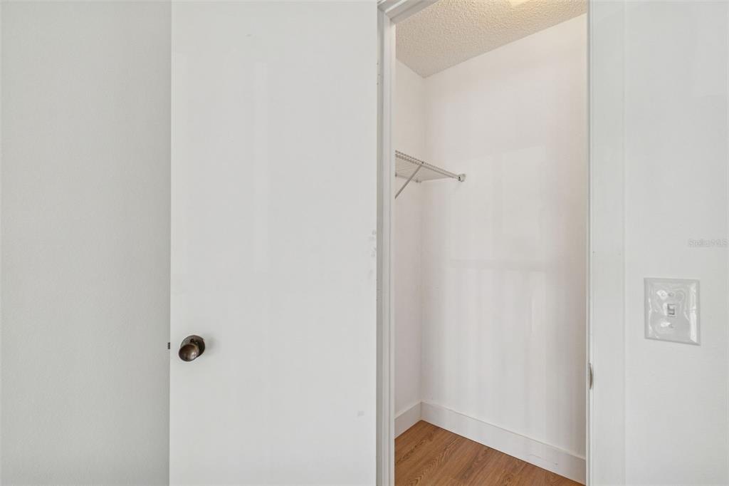 4511 South Oak Drive, Unit R32A Tampa, FL 33611 - Photo 20 of 27 a view of a hallway with wooden floor