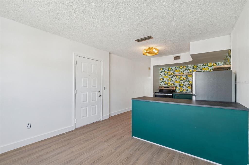 4511 South Oak Drive, Unit R32A Tampa, FL 33611 - Photo 8 of 27 a living room with furniture and a window