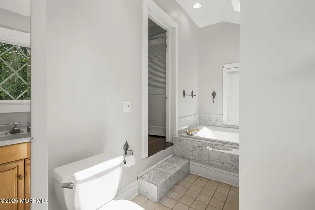 a bathroom with a sink and toilet