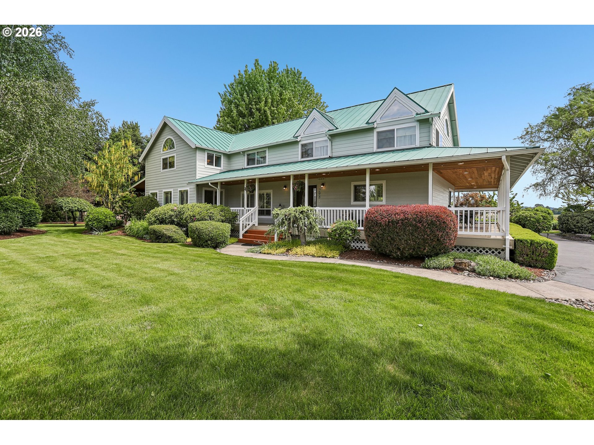 a front view of house with yard and outdoor seating